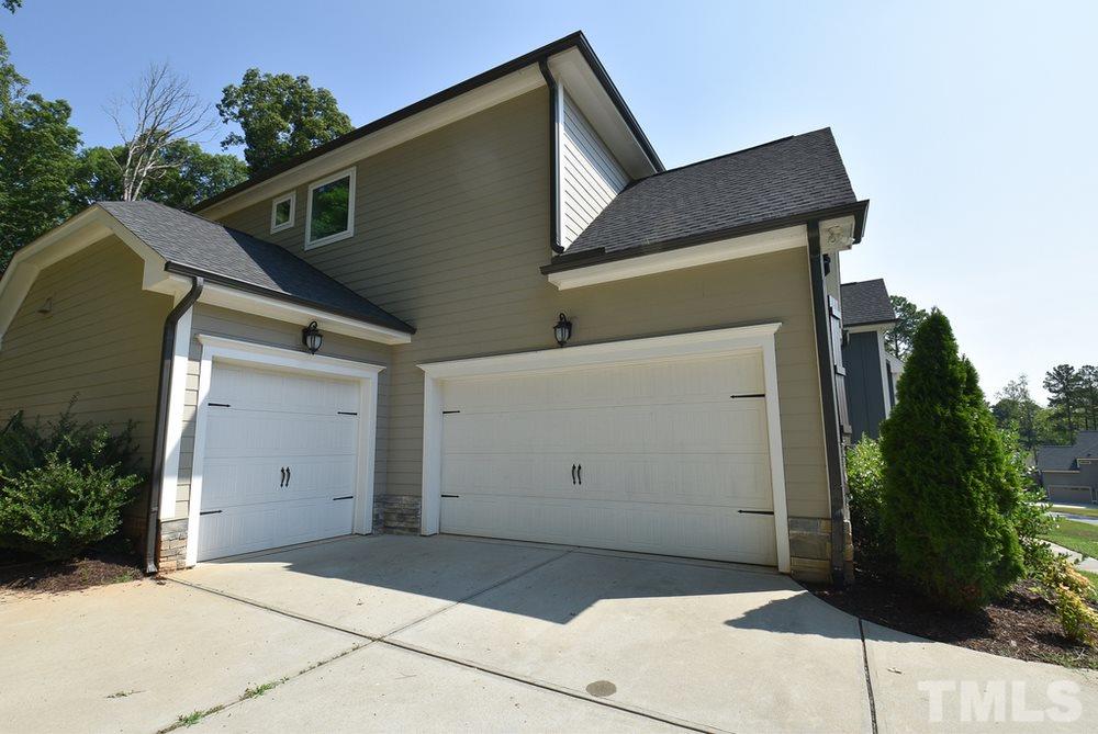 2008 Bowling Green Trail Raleigh, NC 27613 - Photo 2 of 30 Home features board n’ batten & stacked stone exterior, side-load 3-car Garage, basketball hoop, invisible dog fence (around entire .92 ac), sealed crawl space and irrigation system.