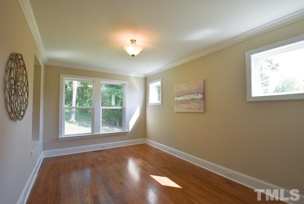 2008 Bowling Green Trail Raleigh, NC 27613 - Photo 13 of 30 Double glass doors lead to the 1st flr Study/Office w/built-in bookshelves & lots of windows; nearby is the Half Bath w/pedestal sink.