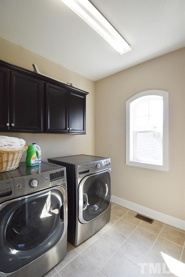 2008 Bowling Green Trail Raleigh, NC 27613 - Photo 24 of 30 Off the Bonus Rm/Loft is the bright Laundry Rm w/neutral tile floor & wall cabinets.