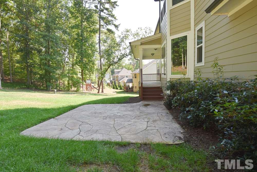 2008 Bowling Green Trail Raleigh, NC 27613 - Photo 26 of 30 The covered rear Porch steps down to the lg stamped concrete Patio.