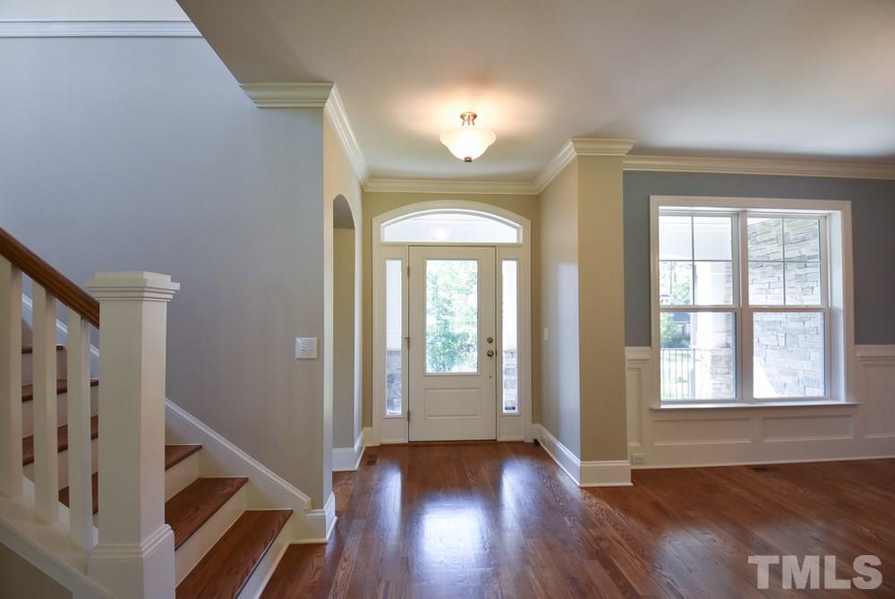2008 Bowling Green Trail Raleigh, NC 27613 - Photo 28 of 30 9’ smooth ceilings, crown molding & hardwood floors throughout main level. Very open floorplan w/gracious Entry w/arched transom, sidelights & coat closet.