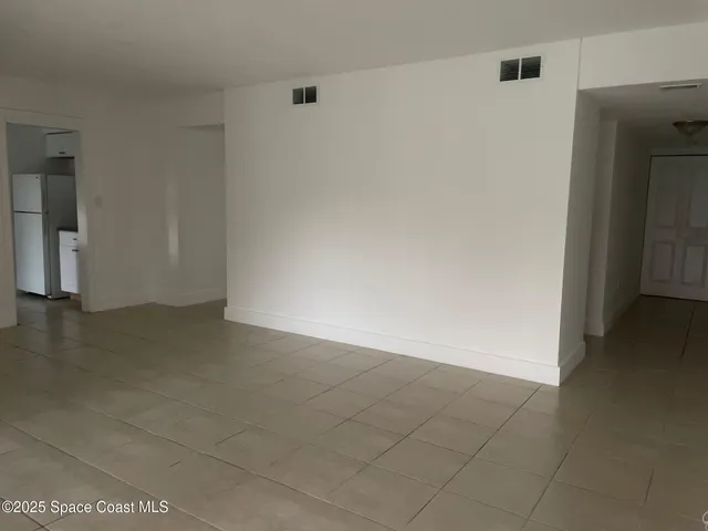 an empty room with entrance door