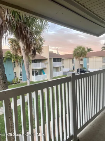 a view of a street from a balcony