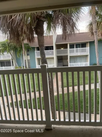 a view of a small yard from a balcony