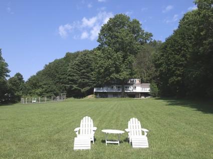0 Withheld Road Salisbury, CT 06039 - Photo 2 of 10 a front view of a house with a yard and trees