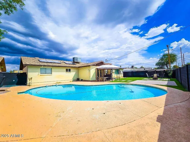 a view of outdoor space and swimming pool