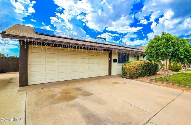a front view of house with garden
