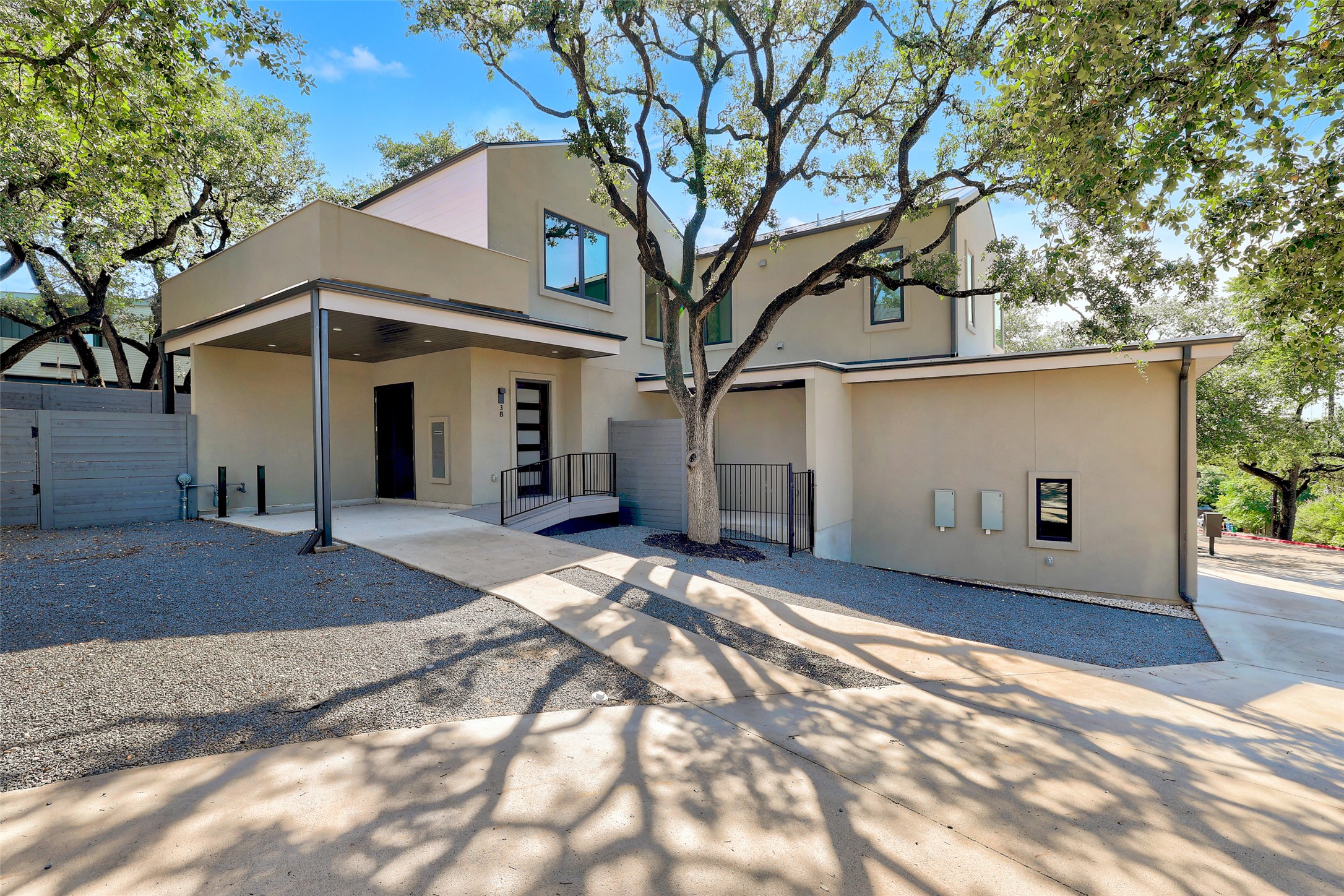 3208 Clawson Road, Unit 3B Austin, TX 78704 - Photo 1 of 1 Back of house with a gate and stucco siding