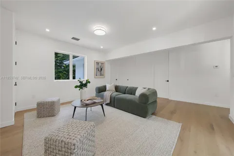 a living room with furniture and a rug
