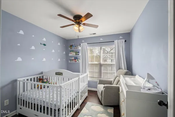a bedroom with furniture and windows