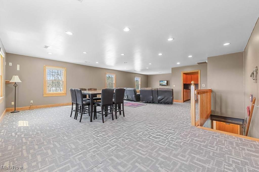 8690 Friendsville Road Lodi, OH 44254 - Photo 18 of 50 Carpeted dining area with visible vents, recessed lighting, and baseboards