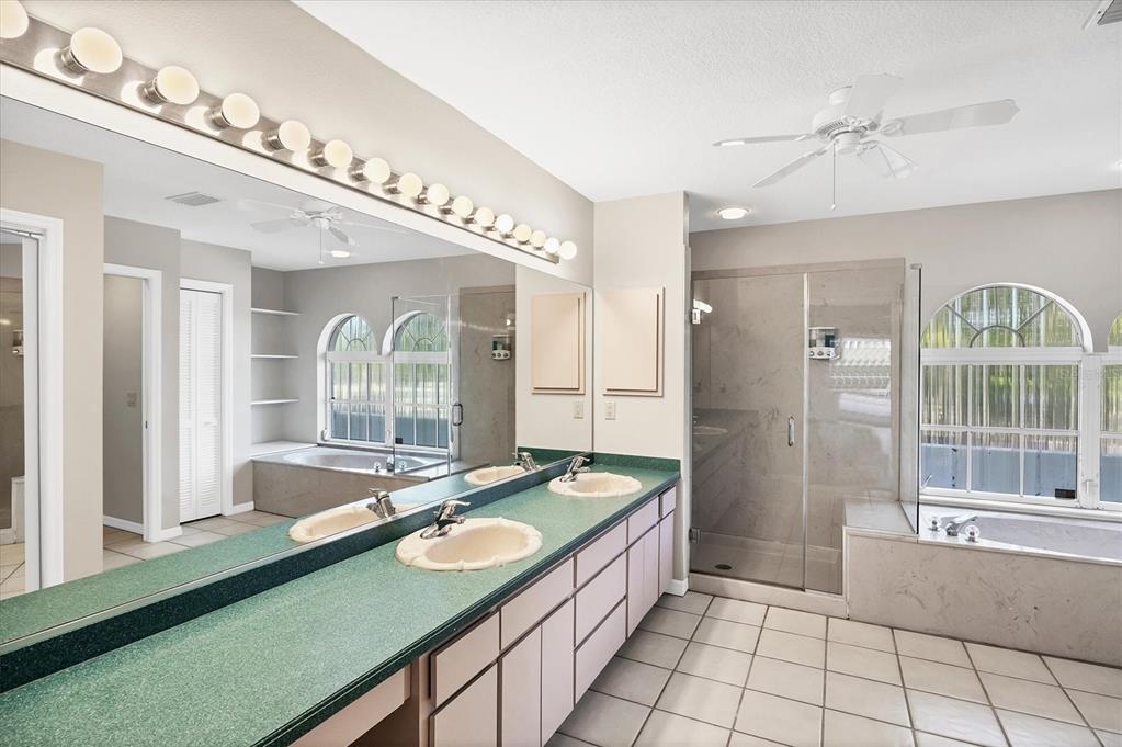 365 Capstan Drive Placida, FL 33946 - Photo 17 of 33 a spacious bathroom with a granite countertop sink mirror and bathtub