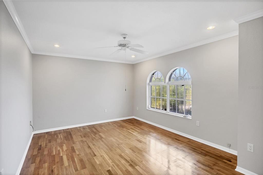 365 Capstan Drive Placida, FL 33946 - Photo 19 of 33 wooden floor in an empty room with a window