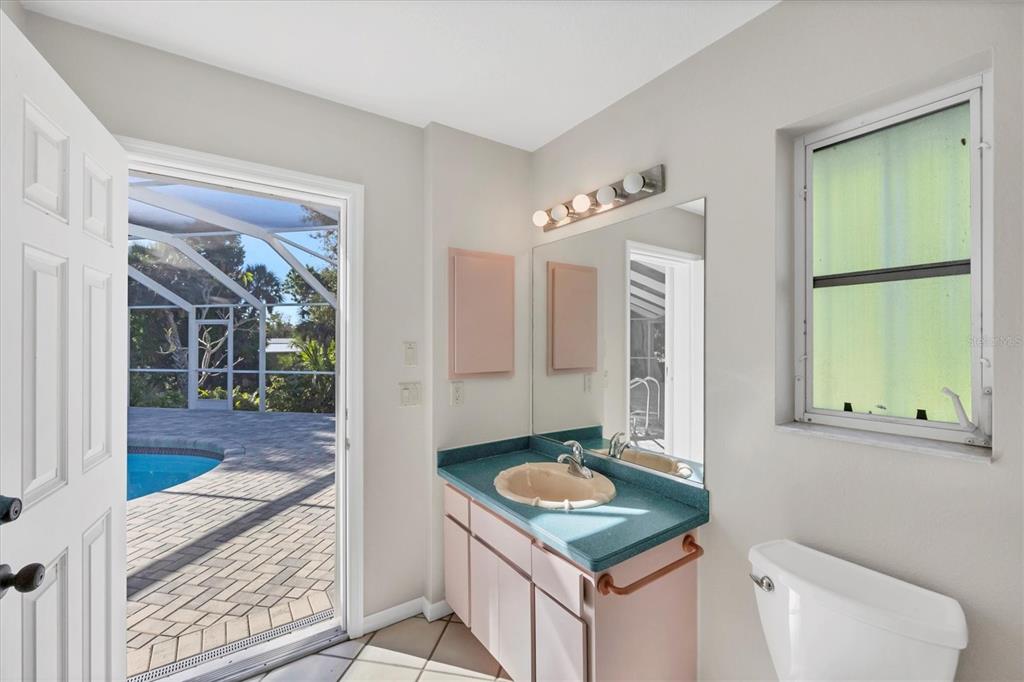 365 Capstan Drive Placida, FL 33946 - Photo 22 of 33 a bathroom with a sink a toilet and shower