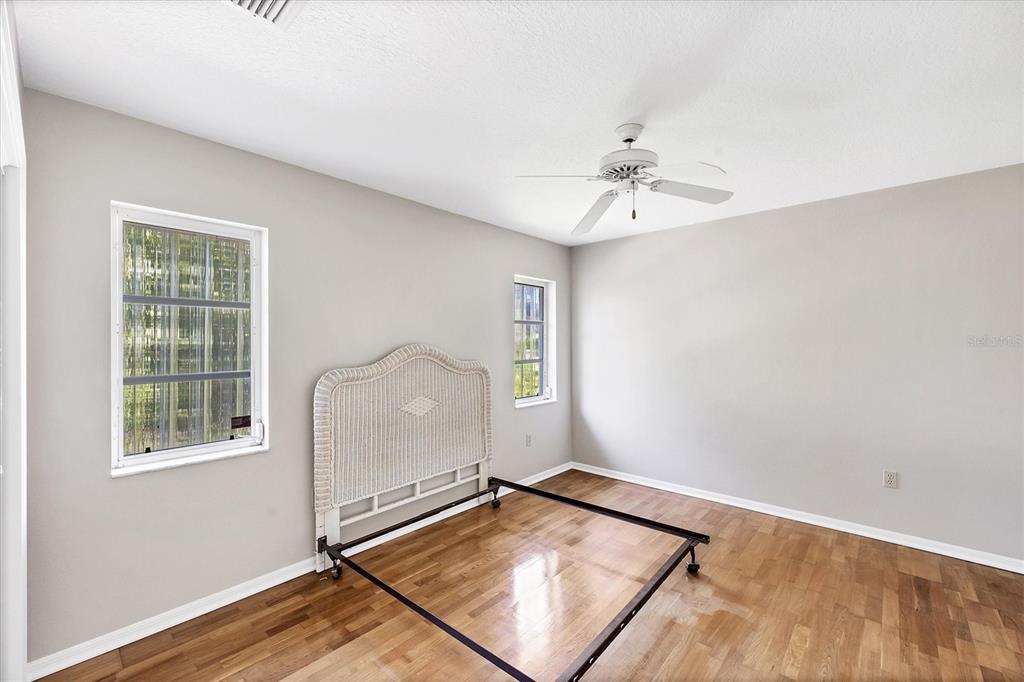 365 Capstan Drive Placida, FL 33946 - Photo 23 of 33 an empty room with windows and fan