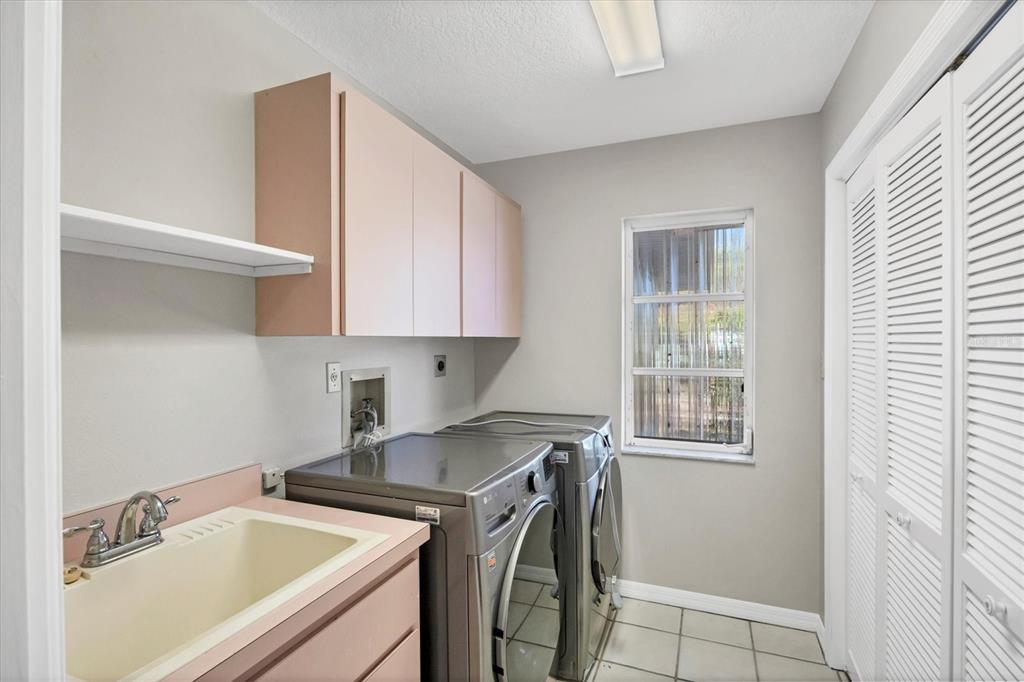 365 Capstan Drive Placida, FL 33946 - Photo 25 of 33 a utility room with sink dryer and washer