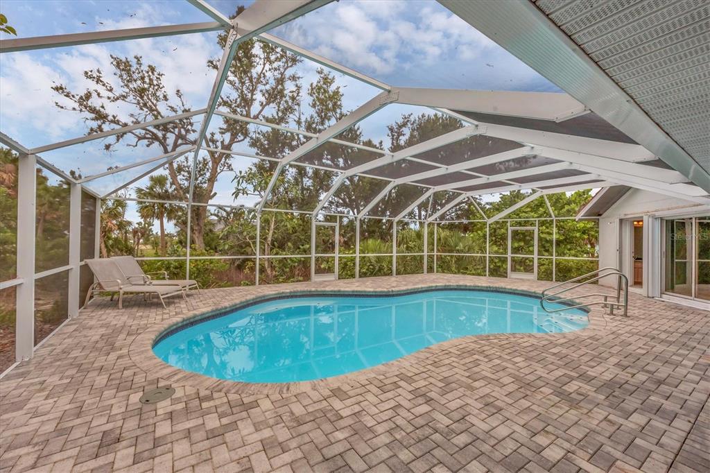 365 Capstan Drive Placida, FL 33946 - Photo 5 of 33 a view of a swimming pool with a patio