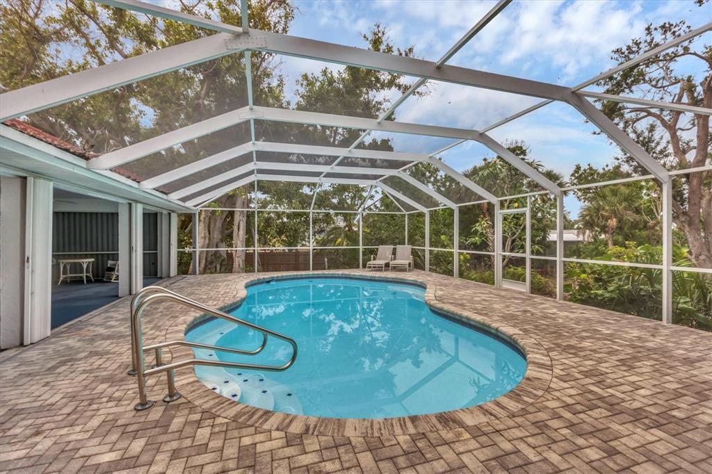 365 Capstan Drive Placida, FL 33946 - Photo 7 of 33 a view of a swimming pool with a patio and a yard
