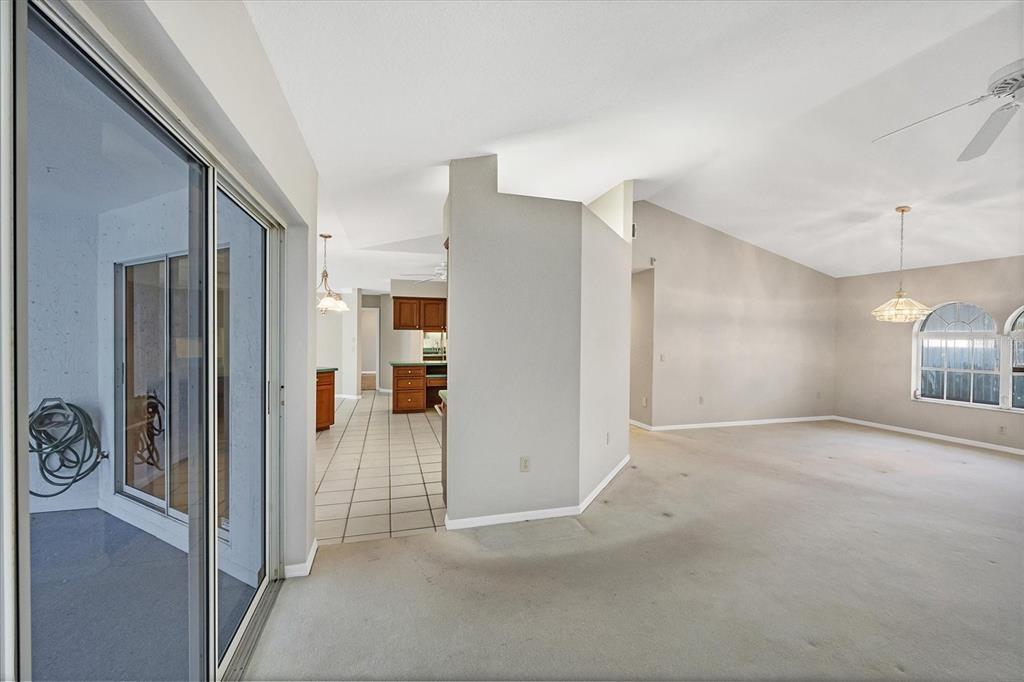 365 Capstan Drive Placida, FL 33946 - Photo 8 of 33 a view of a hallway with a refrigerator and a stove