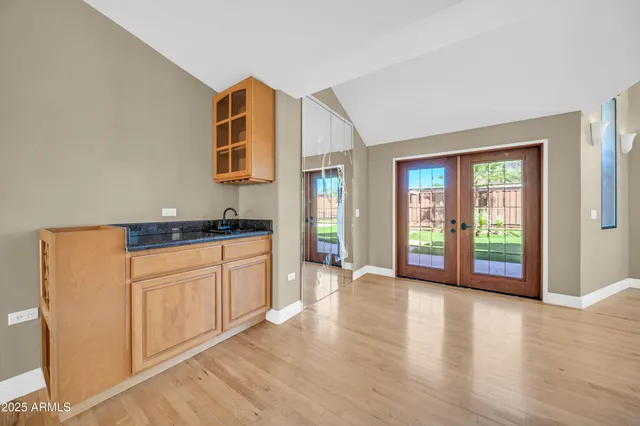 a white toilet sitting next to a bathroom sink