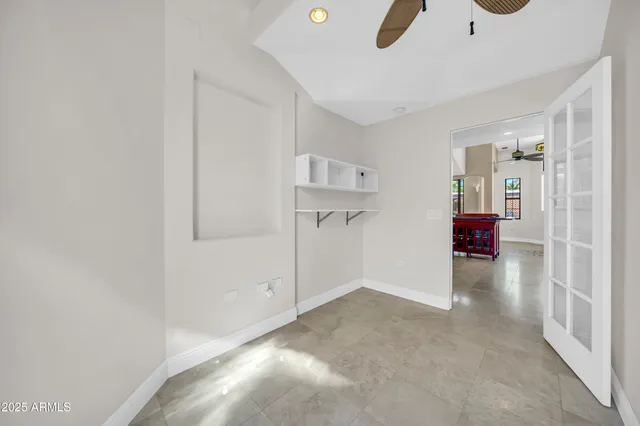 a view of a patio with a table and chairs