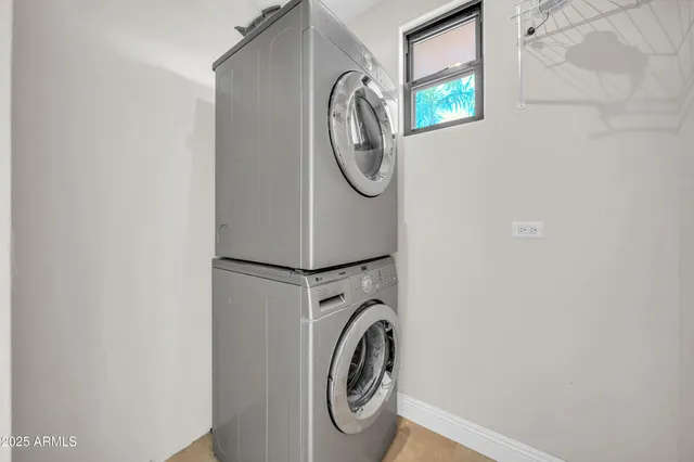 a view of a swimming pool with a house in the background