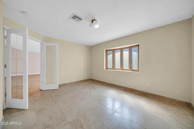 an aerial view of residential houses with outdoor space and parking