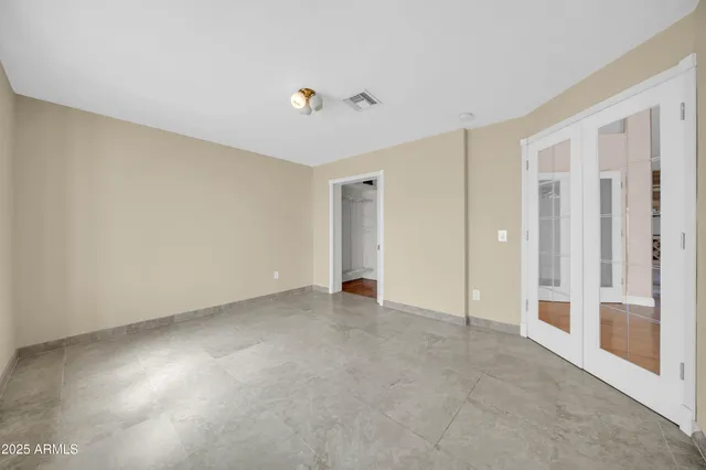 a view of a hallway with wooden floor and a fireplace
