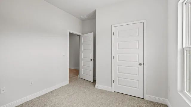 a bathroom with a granite countertop toilet and a shower