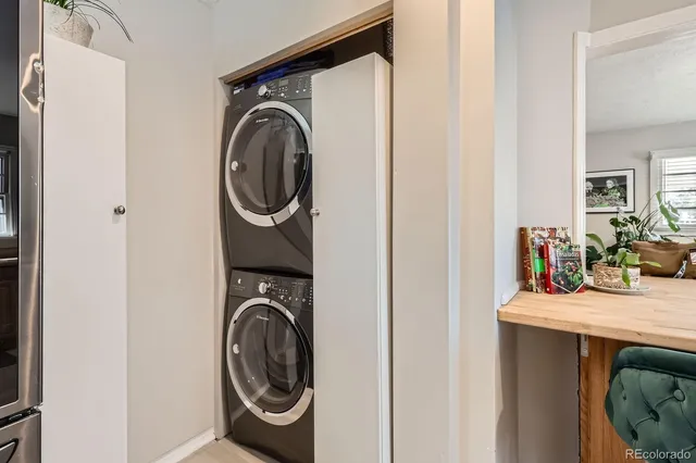 a utility room with sink dryer and washer