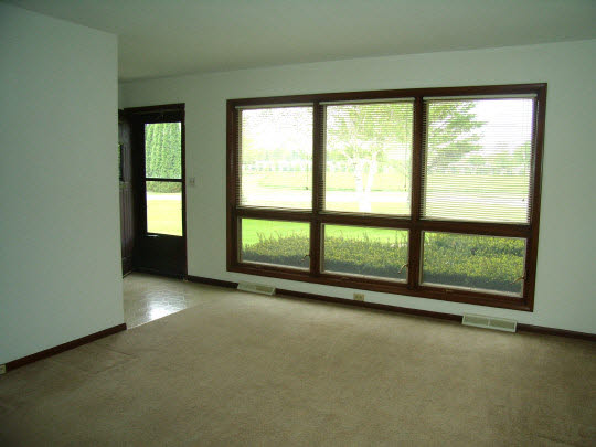 7235 Garden Prairie Road Garden Prairie, IL 61038 - Photo 2 of 11 a view of empty room with floor to ceiling window