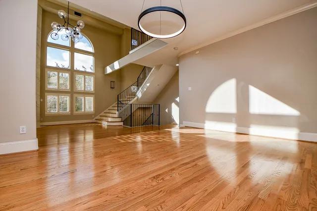 a kitchen with stainless steel appliances granite countertop a stove and a refrigerator