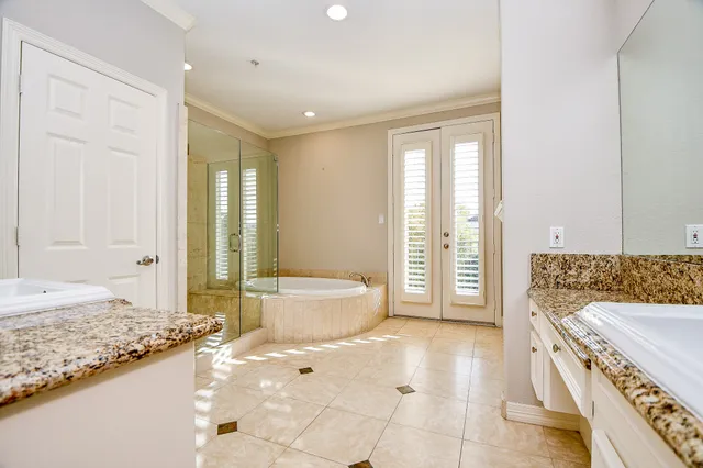 a bathroom with a tub sink and toilet