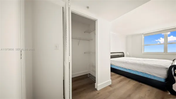 a room with a bed and a window