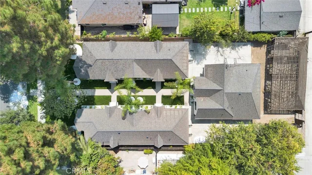 an aerial view of a house with a garden and swimming pool