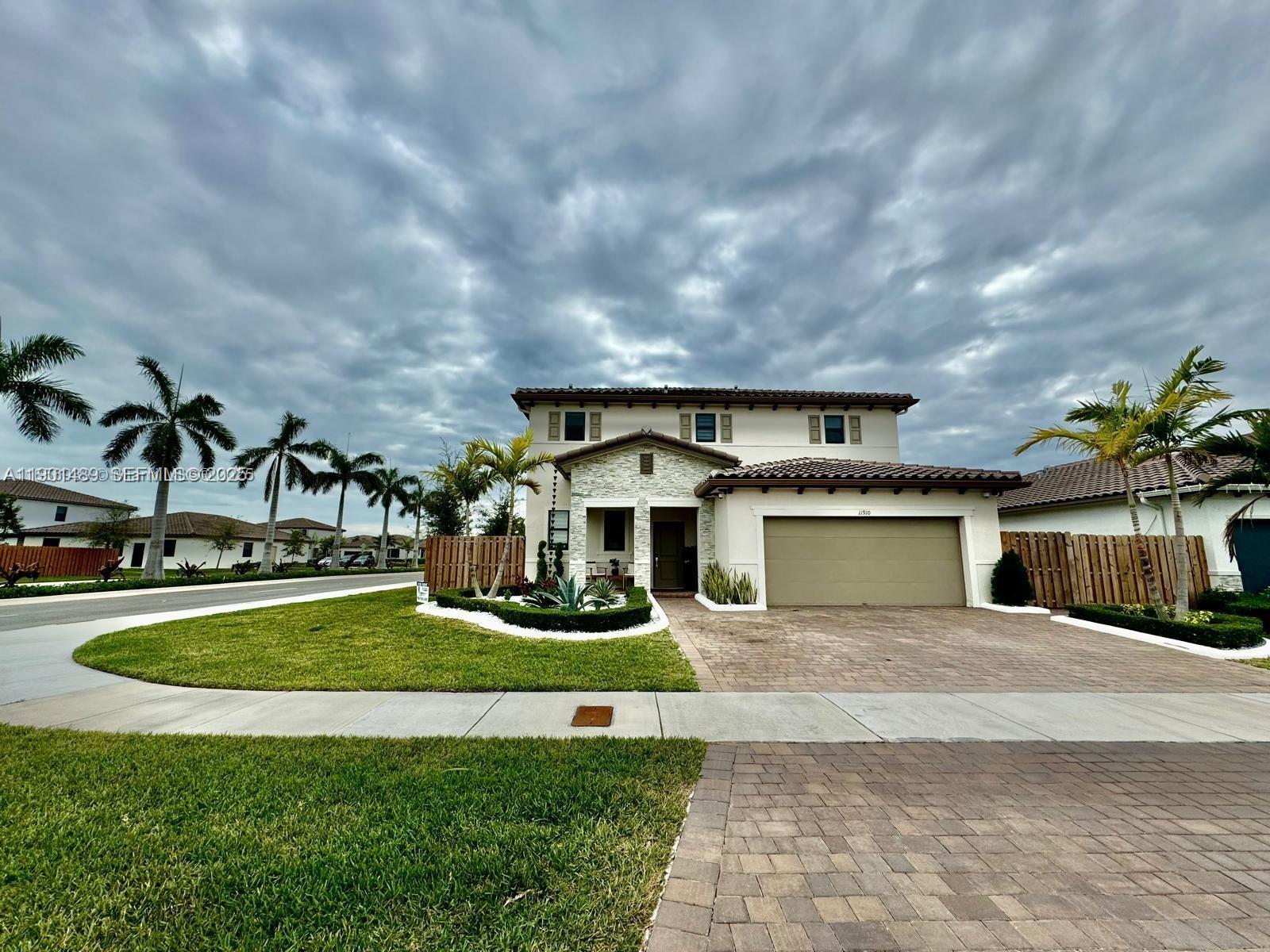 11910 Southwest 243rd Street Homestead, FL 33032 - Photo 24 of 24 a view of house with yard and entertaining space