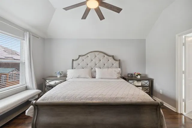 a bedroom with a bed and window