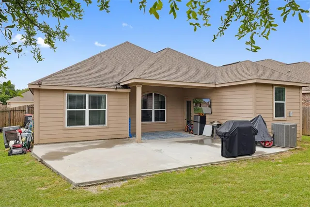 a front view of a house with yard porch and furniture