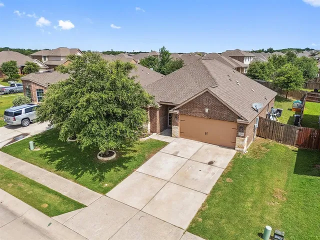 a aerial view of a house with a yard