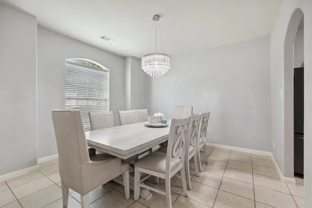 a view of a dining room with furniture and window
