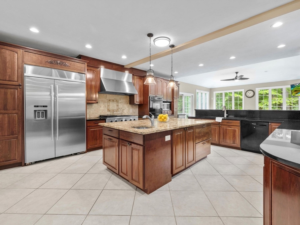 12 Breton Road Upton, MA 01568 - Photo 11 of 42 a kitchen with stainless steel appliances granite countertop a stove a sink a refrigerator and cabinets