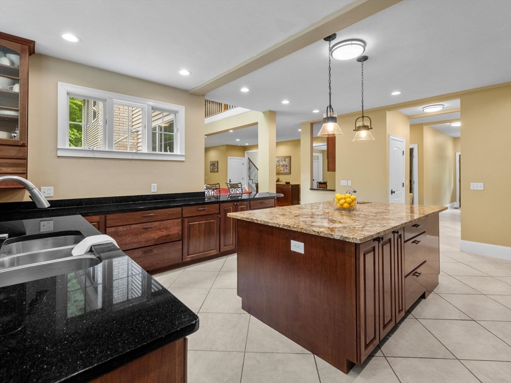 12 Breton Road Upton, MA 01568 - Photo 12 of 42 a kitchen with kitchen island granite countertop a stove and a sink