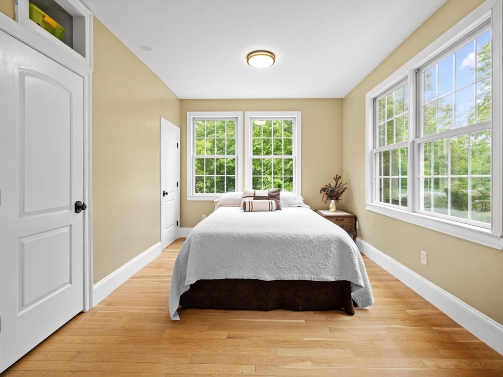12 Breton Road Upton, MA 01568 - Photo 17 of 42 a spacious bedroom with a bed and a window