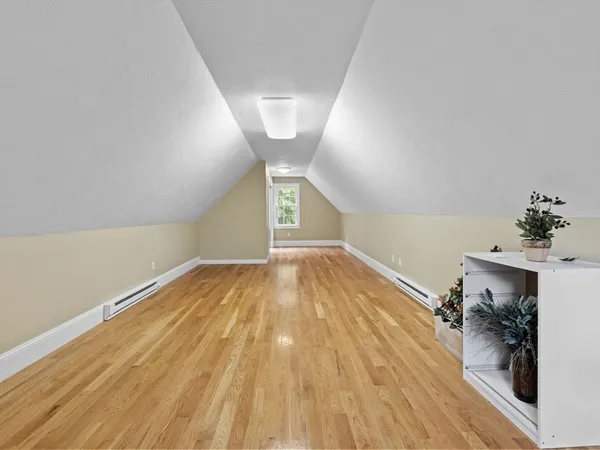 a view of a room with wooden floor and staircase