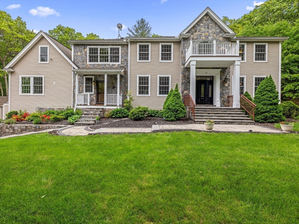 12 Breton Road Upton, MA 01568 - Photo 2 of 42 a front view of a house with a yard
