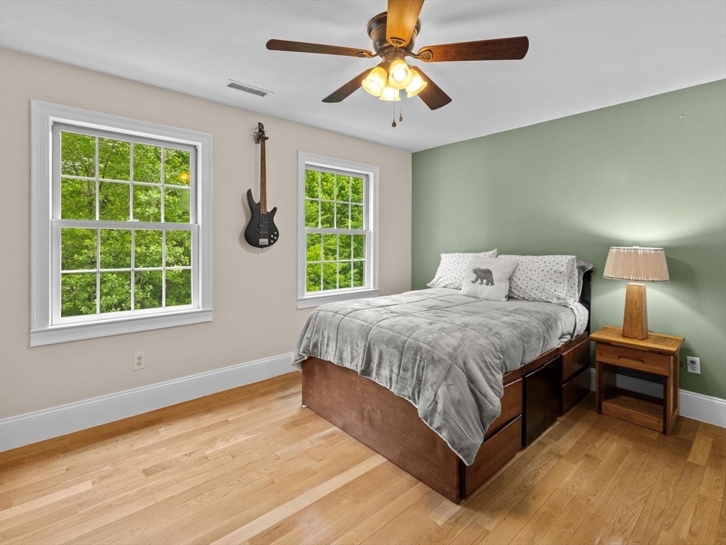 12 Breton Road Upton, MA 01568 - Photo 26 of 42 a spacious bedroom with a bed and a window