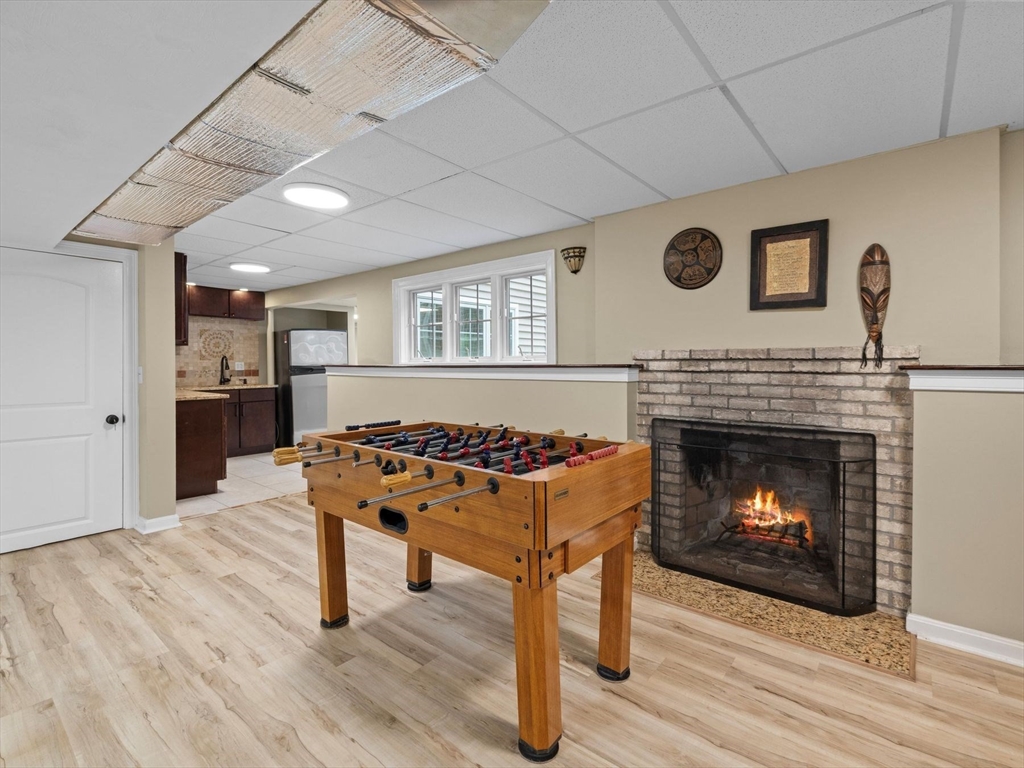12 Breton Road Upton, MA 01568 - Photo 33 of 42 a living room with furniture and a fireplace