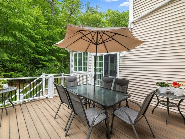 an outdoor space with furniture and umbrella