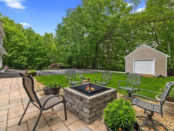 a view of a chairs and table in the garden