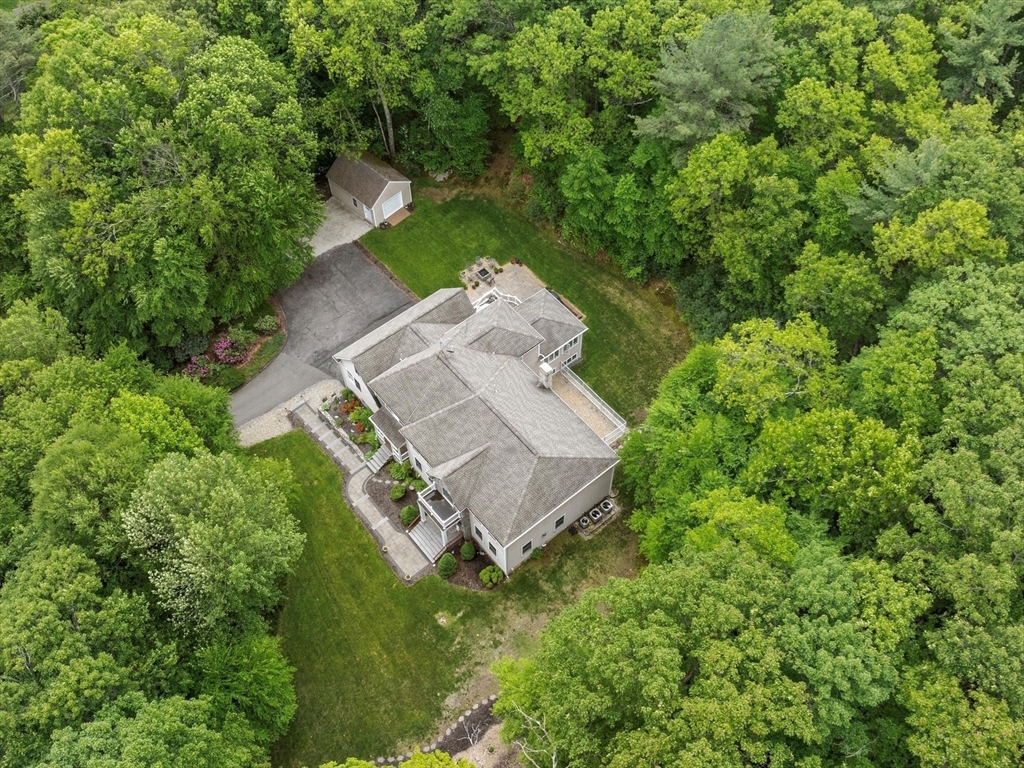 12 Breton Road Upton, MA 01568 - Photo 42 of 42 an aerial view of a house with a yard and large trees